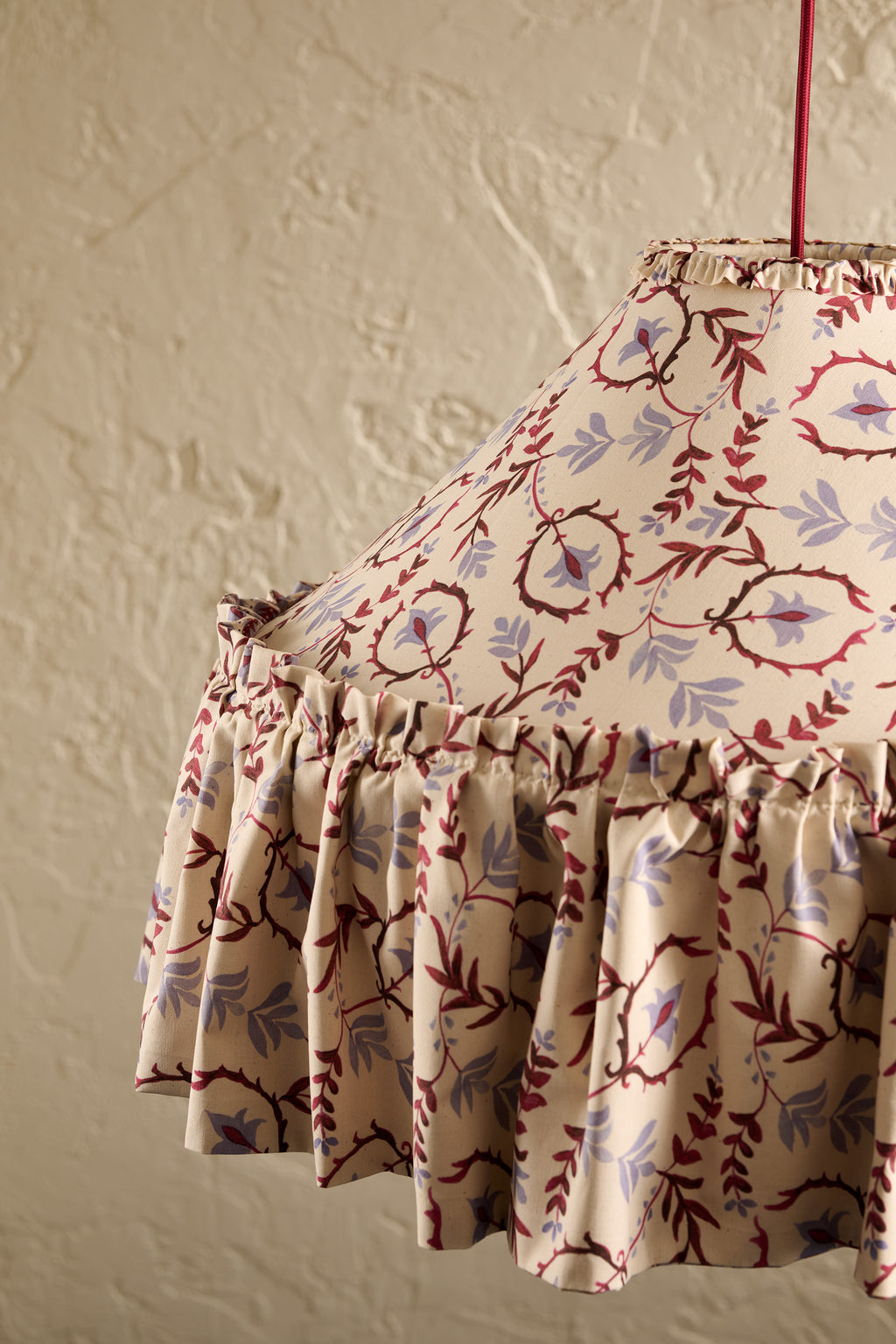 Daunder Ruffle Statement Lampshade in Merlot & Dusty Blue, showing the hand-painted botanical print and frill hem details on the skirt lampshade