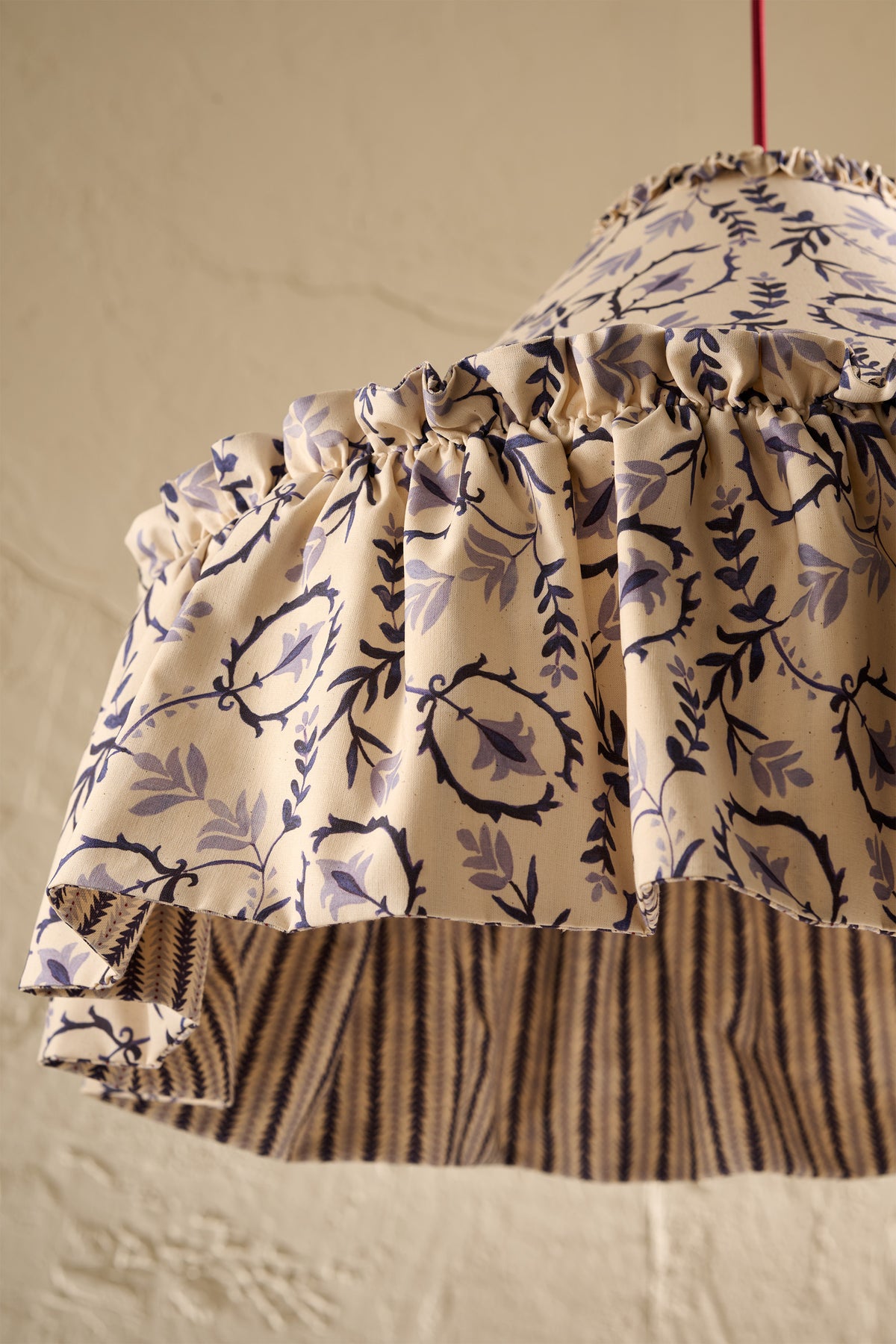 Daunder Ruffle Statement Lampshade in Indigo showing a close up of the ruffled skirt and contrast lining
