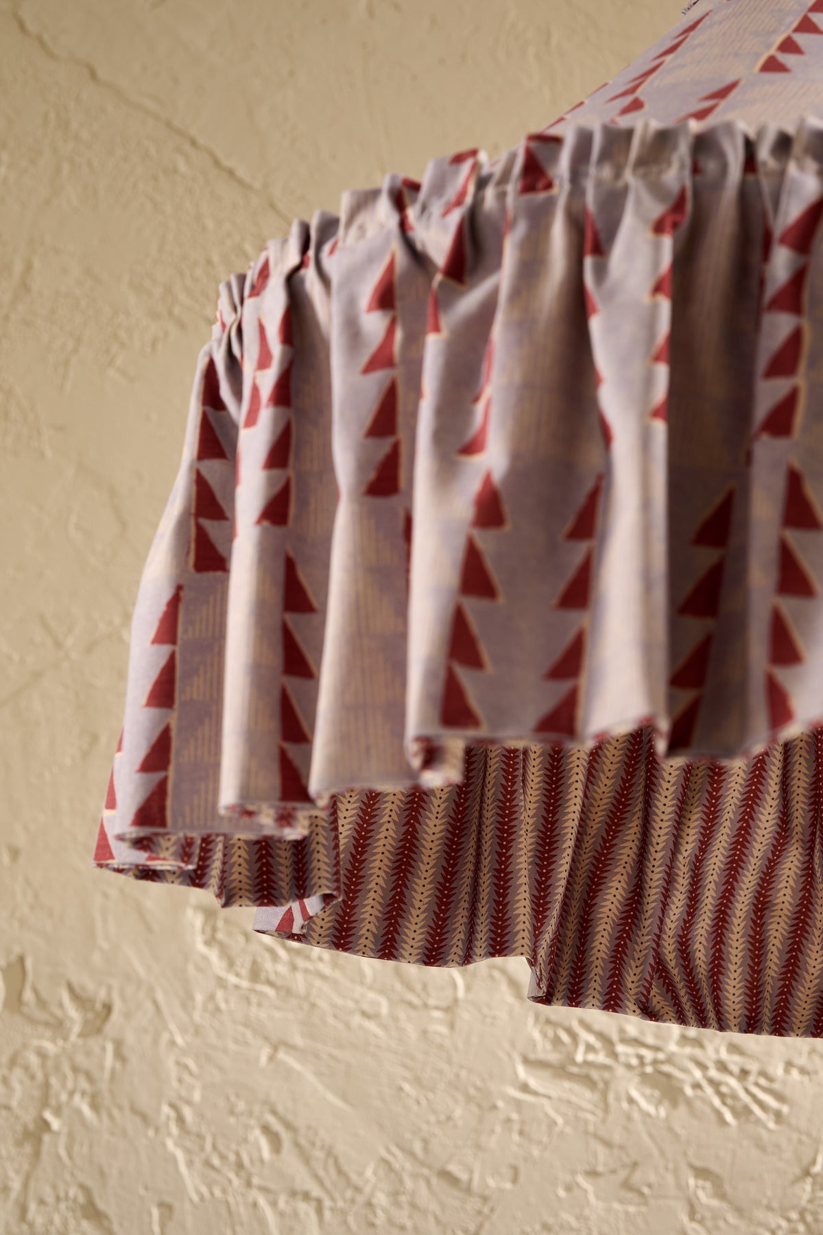 Close-up of Ellis Ruffle Statement Lampshade in Dusty Blue & Merlot showing the gathered ruffle and contrasting geometric lining
