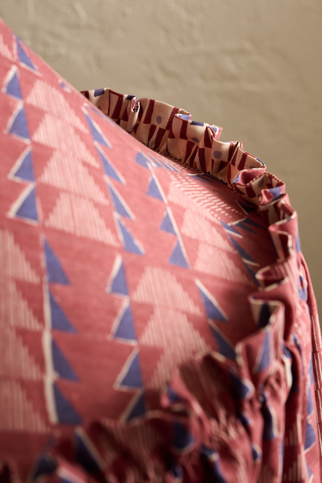 Close-up of Ellis Ruffle Statement Lampshade in Merlot showing the gathered ruffled edge and contrasting geometric lining