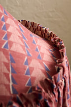 Close-up of Ellis Ruffle Statement Lampshade in Merlot showing the gathered ruffled edge and contrasting geometric lining