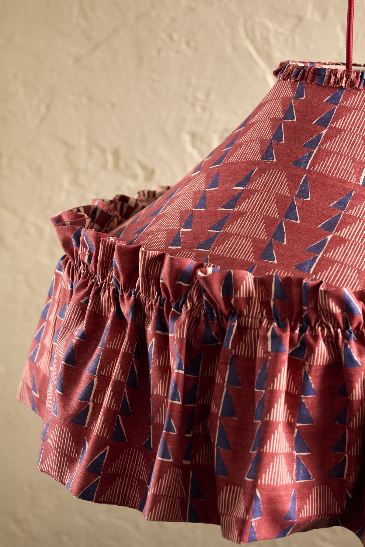 Close-up of Ellis Ruffle Statement Lampshade in Merlot showing the gathered ruffle hem detail