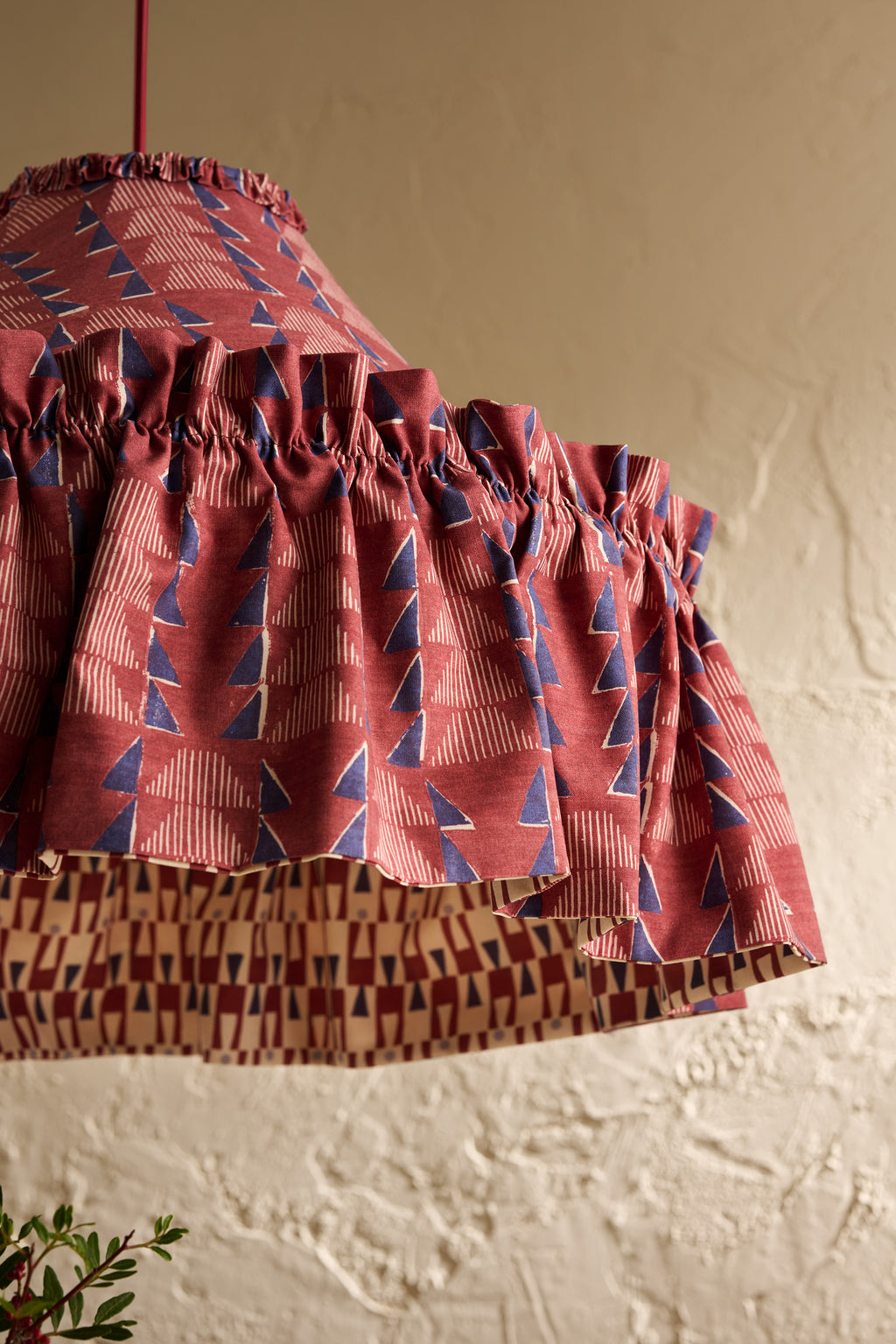 Close-up of Ellis Ruffle Statement Lampshade in Merlot showing the gathered ruffle and contrasting geometric lining