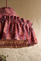 Close-up of Ellis Ruffle Statement Lampshade in Merlot showing the gathered ruffle and contrasting geometric lining